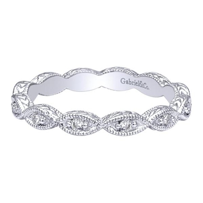 Curved 14k white gold delicately cradles round brilliant diamonds in this lightly embellished diamond stack ring.