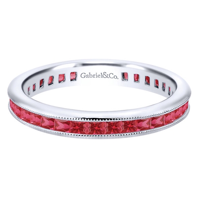 Gorgeous princess cut rubies are set into 14k white gold in this channel set 14k white gold ruby stackable ring.