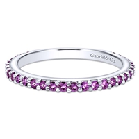 This 14k white gold stackable ring features a row of purple amethysts.
