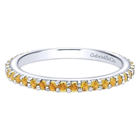 This 14k white gold stackable ring features citrine stones.