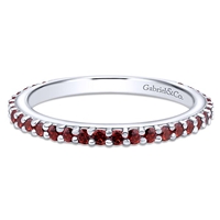 A garnet stackable ring in 14k white gold.