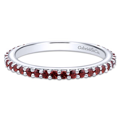 A garnet stackable ring in 14k white gold.