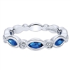 This 14k white gold diamond stackable ring features sapphires and diamonds.