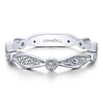 This 14k white gold diamond stackable ring features dramatic diamond sections.