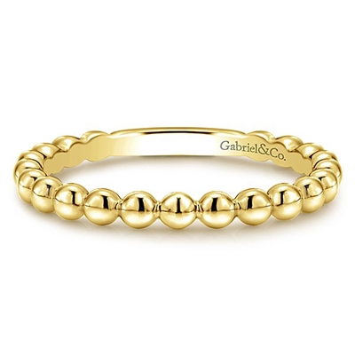 This 14k yellow gold stackable ring features beads.