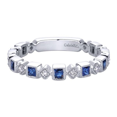 Sapphires and diamonds and white gold oh my! Deep blue sapphires and diamond accents create this signature style from Gabriel and Co. Get you 14k white gold sapphire and diamond stackable ring and begin your life as a fashionista!