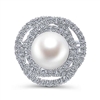This 14k white gold diamond ring features a pearl swimming in the center of a swirling diamond halo.