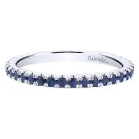 Round sapphires assemble along 14k white gold in this stunningly simple and elegant stackable ring.