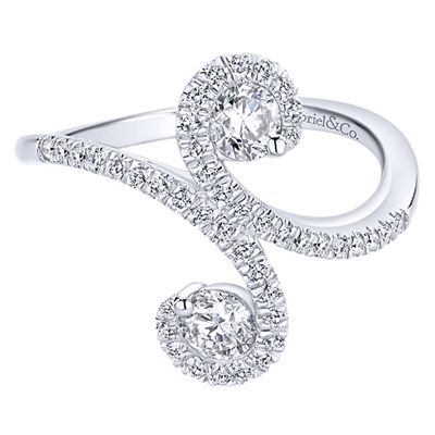 14k white gold provides the base over which round brilliant diamonds are set in this diamond fashion ring.