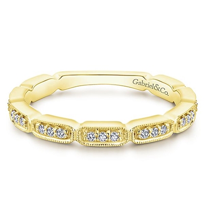 This channel set 14k yellow gold diamond stackable ring features round brilliant diamonds.