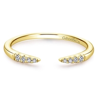 This open diamond stackable ring is in 14k yellow gold.