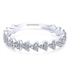 This stunning 14k white gold diamond stackable ring features a row of triangular diamond sections.