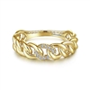 A 14k yellow gold cuban link stackable diamond ring.