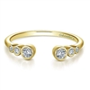 This 14k yellow gold diamond stackable ring features 6 round bezel set diamonds.