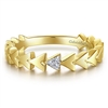 This 14k yellow gold pyramid diamond stackable ring features diamond accents.