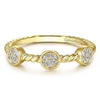 Diamond sections fill this 14k yellow gold stackable ring.