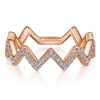 This 14k rose gold diamond stackable ring drips with diamonds.