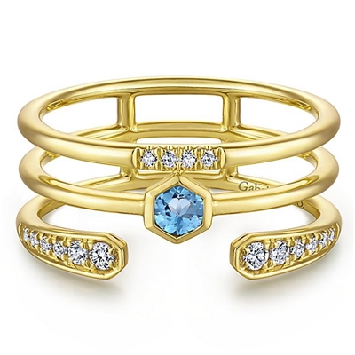 This 14k yellow gold ring is stacked with blue topaz and diamonds.