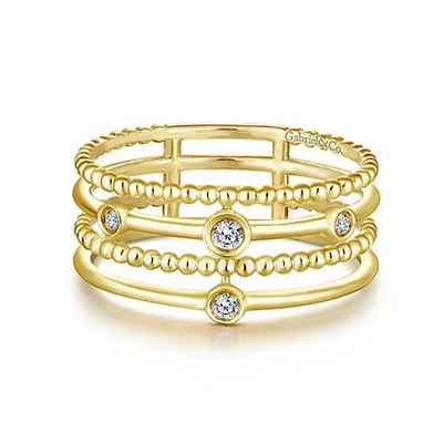 This beaded diamond ring in 14k yellow gold features delicate diamond accents.