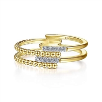 This 14k yellow gold diamond stackable ring features beaded gold with rows of diamonds.