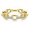 A diamond stackable ring featuring two diamond sections in 14k yellow gold.