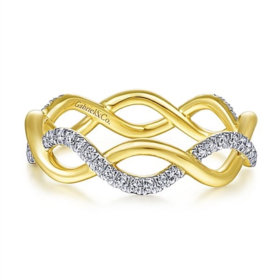 Diamonds shimmer in the center of this 14k yellow gold infinity swirl diamond ring.