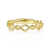 This 14k yellow gold stackable ring features a delicate weave of 14k yellow gold bands.