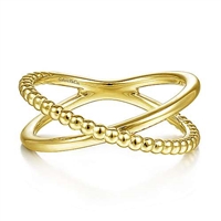 This beaded and smooth 14k yellow gold stackable ring features a modern x shape.