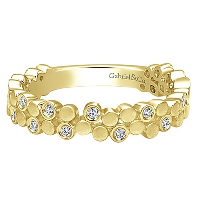 This 14k yellow gold diamond stackable ring features 0.12 carats of diamonds.