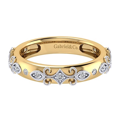 This ornate 14k yellow gold ring features 14k white gold decorative diamonds.