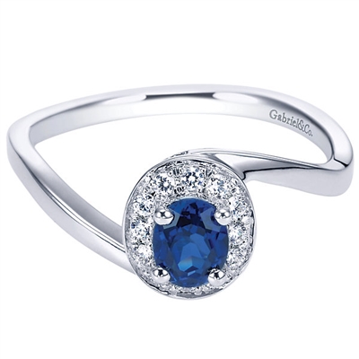 14k white gold with a sapphire and round diamonds in a halo in this gemstone fashion ring.