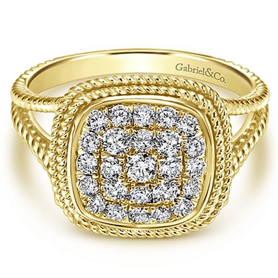 This elegantly styled 14k yellow gold diamond ring boasts one half carats of shimmering diamonds gathered together in a cluster setting..