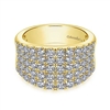This 14k yellow gold wide diamond band features nearly 2 carats of round brilliant diamonds.