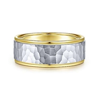 This hammered wedding band is featured in 14k yellow and white gold and is 6mm wide.