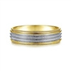 This 14k yellow and white gold men's wedding band features a milgrain channel and is 6 mm wide.