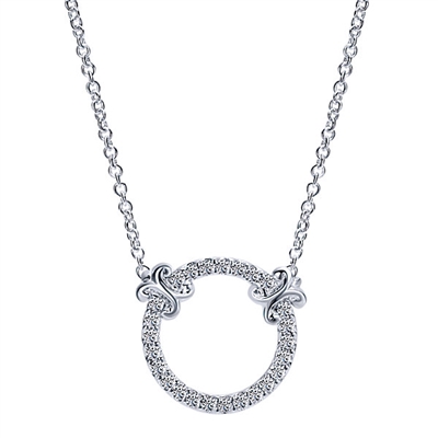 Beautiful 14k white gold serves as the setting for diamond accents in this circle of life style diamond necklace.