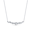 This dreamy diamond bar necklace in 18k white gold features different sized round brilliant diamonds set into a bar.