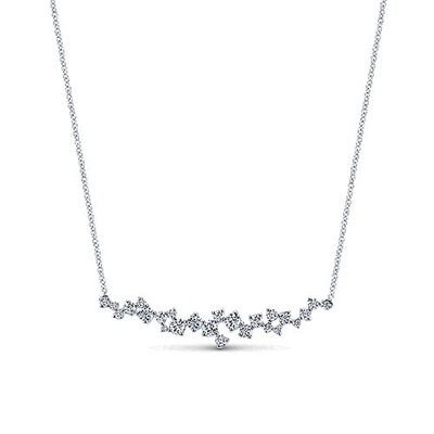 This dreamy diamond bar necklace in 18k white gold features different sized round brilliant diamonds set into a bar.