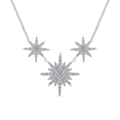 This beautiful diamond necklace features three separate diamond snowflake sections with 0.56 carats total.