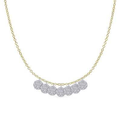 This beautiful 14k white gold diamond necklace features delicate diamond discs.