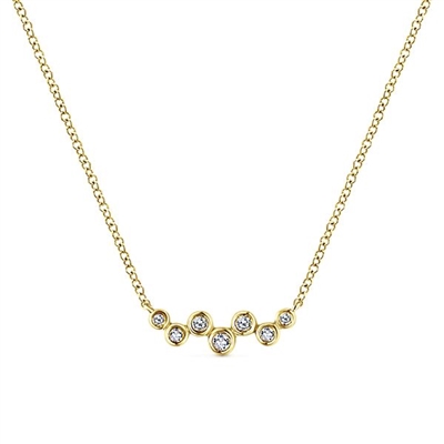 Diamonds hang in this 14k yellow gold bar necklace.