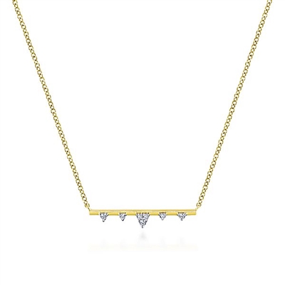 Diamonds shine in this 14k yellow gold bar necklace.