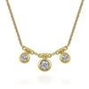 Three diamonds shimmer in this 14k yellow gold diamond necklace.