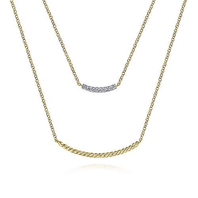 A diamond bar necklace with a layered twisted 14k yellow rope underneath.