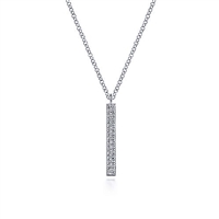 This 14k white gold diamond bar necklace hung vertically.