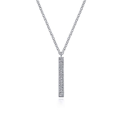 This 14k white gold diamond bar necklace hung vertically.