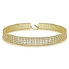 This 14k yellow gold diamond choker necklace features diamonds studded around 14k yellow gold that wrap sweetly around your neck.