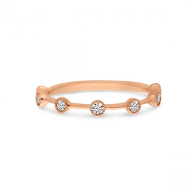 This 14k rose gold diamond bezel set stackable ring features 7 round brilliant cut diamonds with nearly one quarter carats total weight.