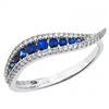 This 14k white gold sapphire and diamond wave ring features 0.16 carats of diamonds with 2 mm sapphires.