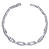 This stylish diamond tennis bracelet boasts nearly one and a quarter carats of round diamonds in oval sections spread throughout this opulent arm piece.